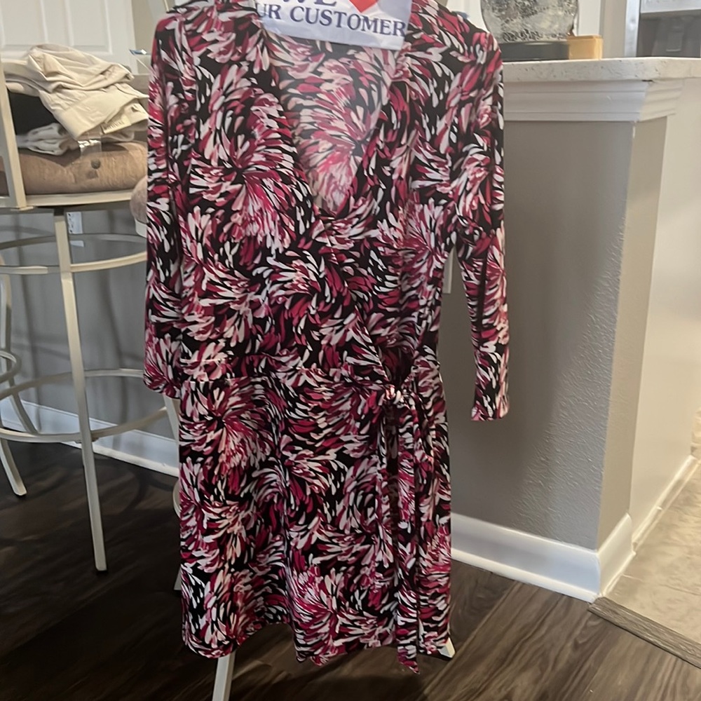 Wrap around romper/dress. Shorts attached, ties at side.